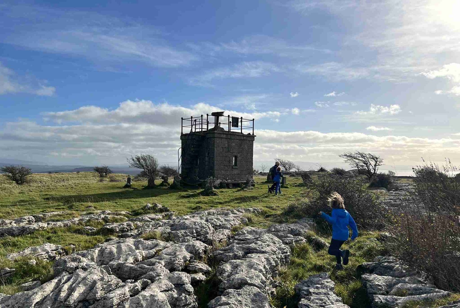 Hampsfell Hospice is pictured, with children playing close by.