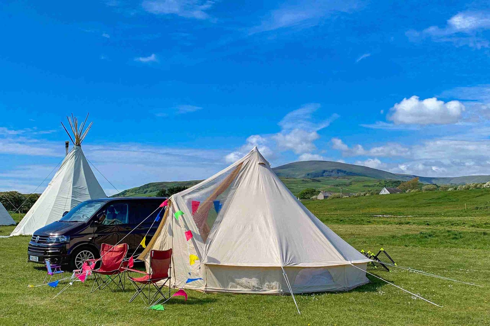 Glawning bell tent awning at Harbour Lights campsite. The Lake District fells are in the background.