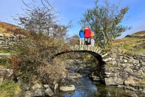 Michelle and two children stand on High Sweden Bridge.